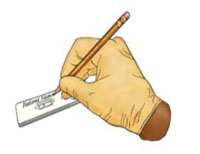 A hand holding a pencil and writing on the cassette.