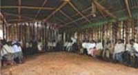 A large group of people gathered in a large community building.