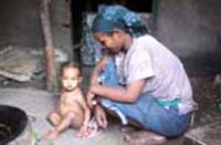 A mother with her child in the home.
