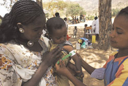 Measuring MUAC of a young child