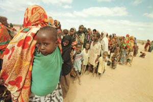 Children and women form an early morning queue